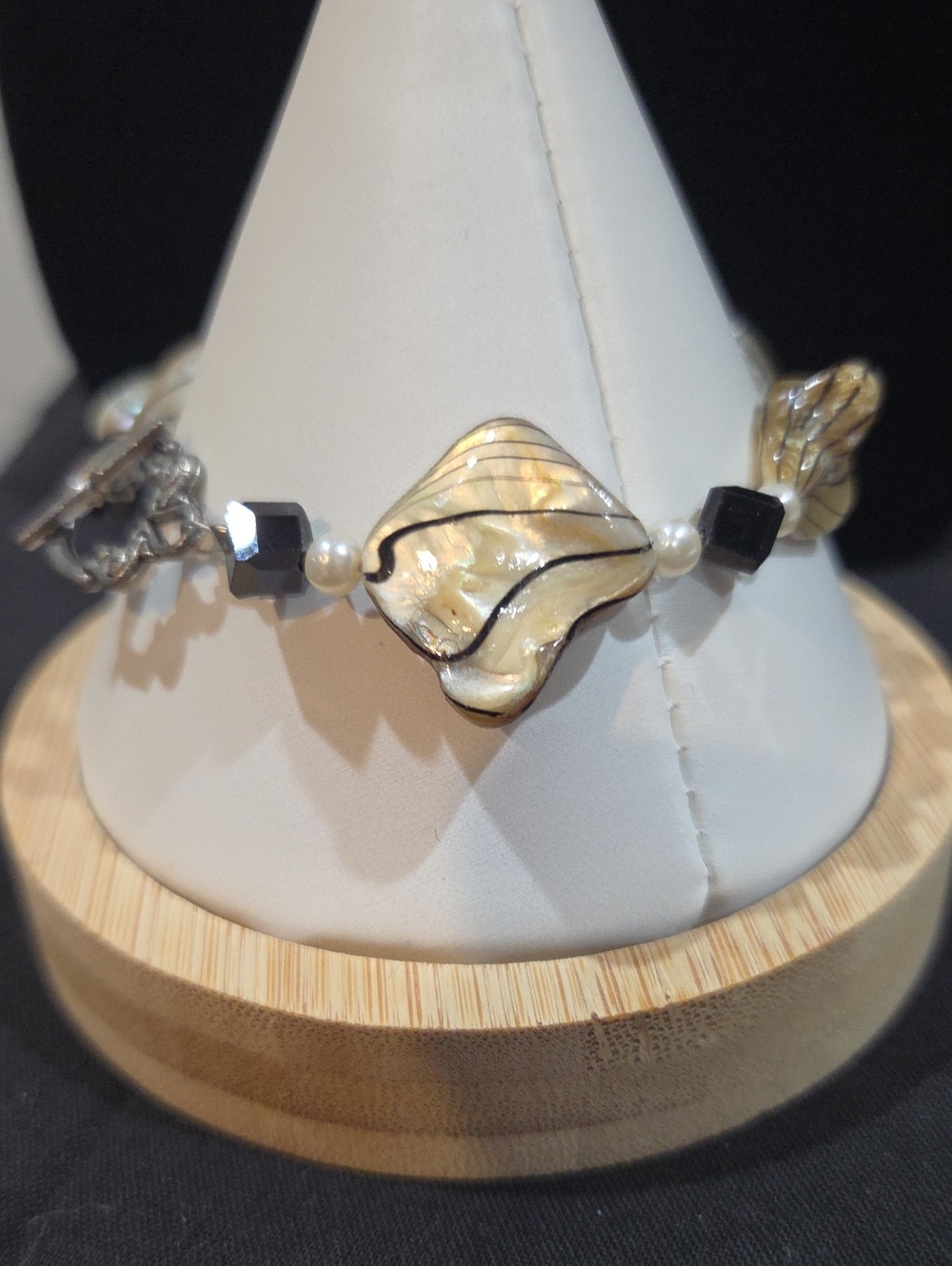 MOTHER OF PEARL LEAF SHAPED BEADS WITH BLACK SQUARE BEADS AND FAUX PEARLS